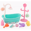 A pink and teal pet spa bath and drying rack playset with a basin, faucet, and accessories.