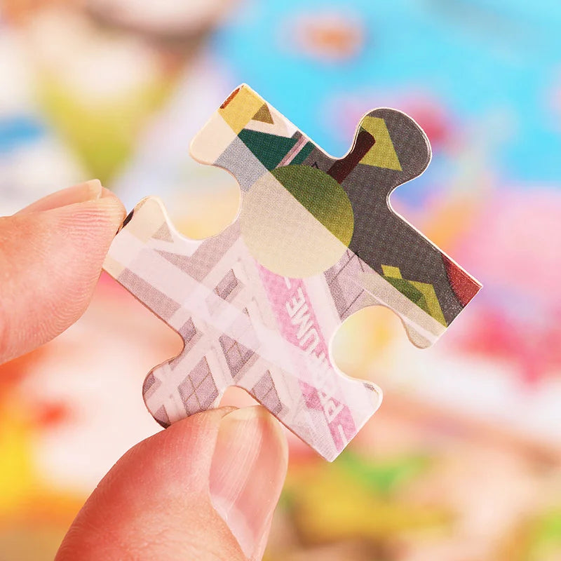 A hand holds a wooden tangram puzzle piece shaped like an animal or vehicle, featuring geometric patterns.