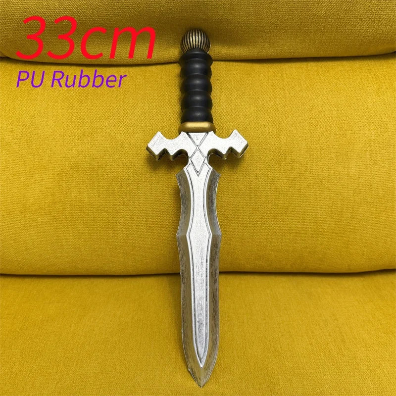 A silver dagger with a black handle and PU rubber grip displayed on a yellow fabric background.