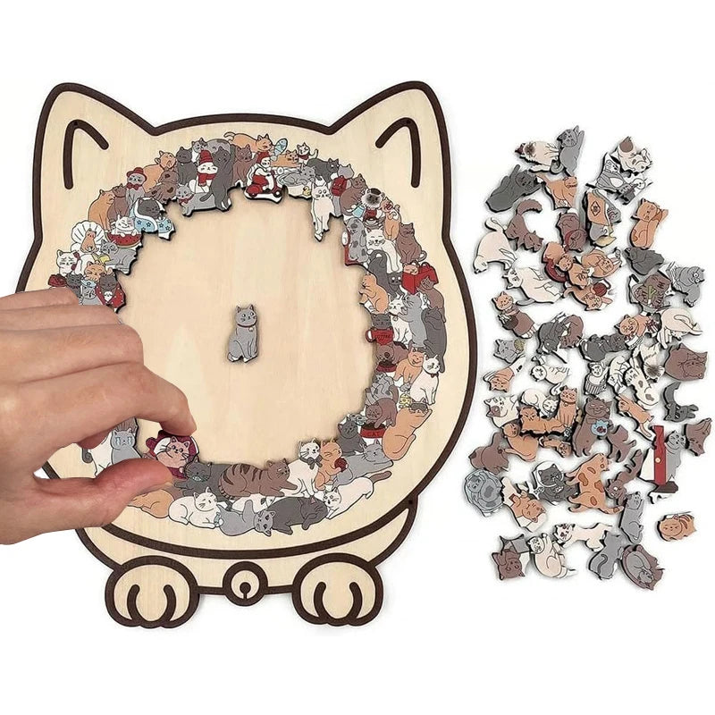 A wooden jigsaw puzzle featuring many cats arranged in a circular pattern, with some pieces scattered beside it.