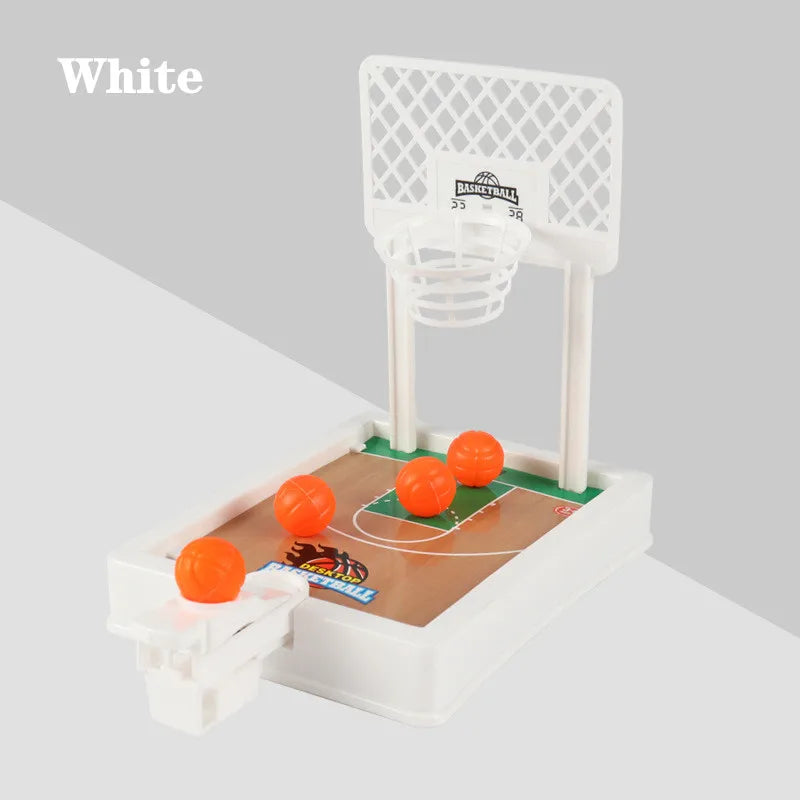 A white tabletop basketball arcade game featuring a basketball hoop and a court with an orange ball.