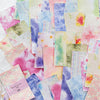 A collection of vintage watercolor paper sheets featuring pink, purple, green, and yellow tones.