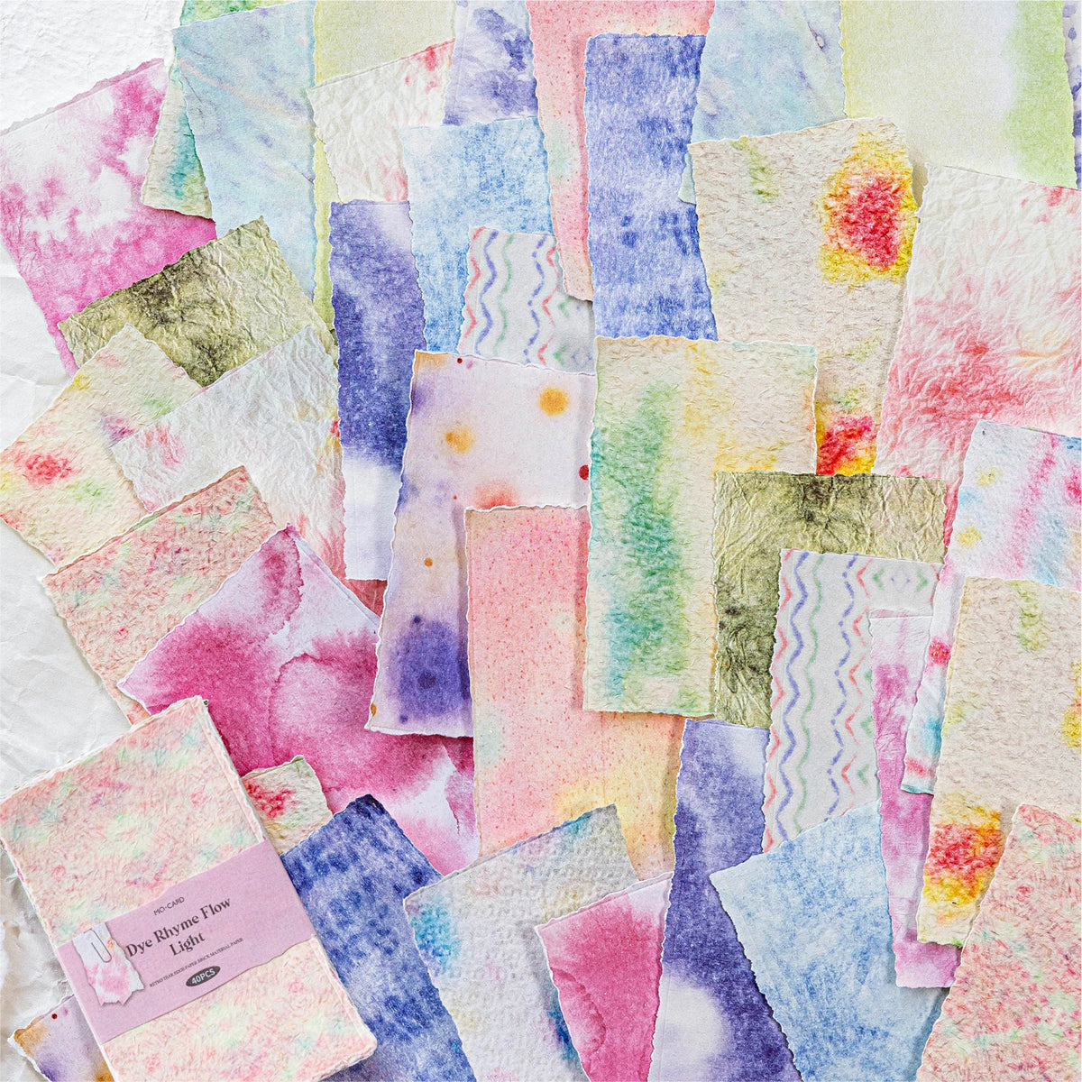 A collection of vintage watercolor paper sheets featuring pink, purple, green, and yellow tones.