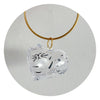 A clear, dog-shaped keepsake charm attached to a gold-colored chain.