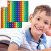 A colorful multiplication pop-it math fidget toy showing grids of numbers from 1 to 100.