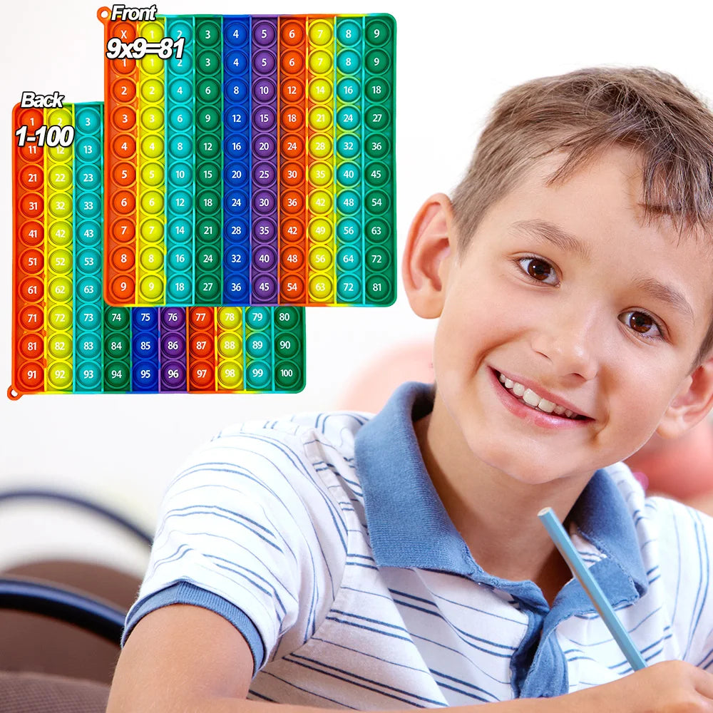 A colorful multiplication pop-it math fidget toy showing grids of numbers from 1 to 100.