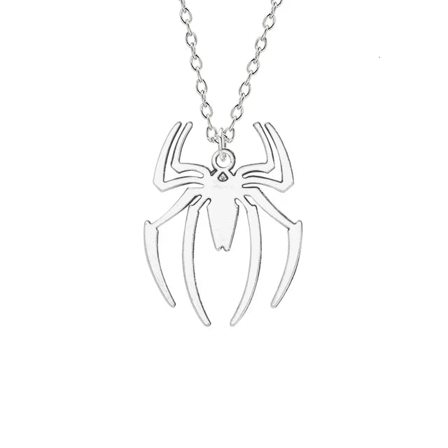 Silver spider pendant necklace with a chain and a small charm.