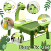 A green kids drawing projector is shown with various learning activities and a small green dinosaur.