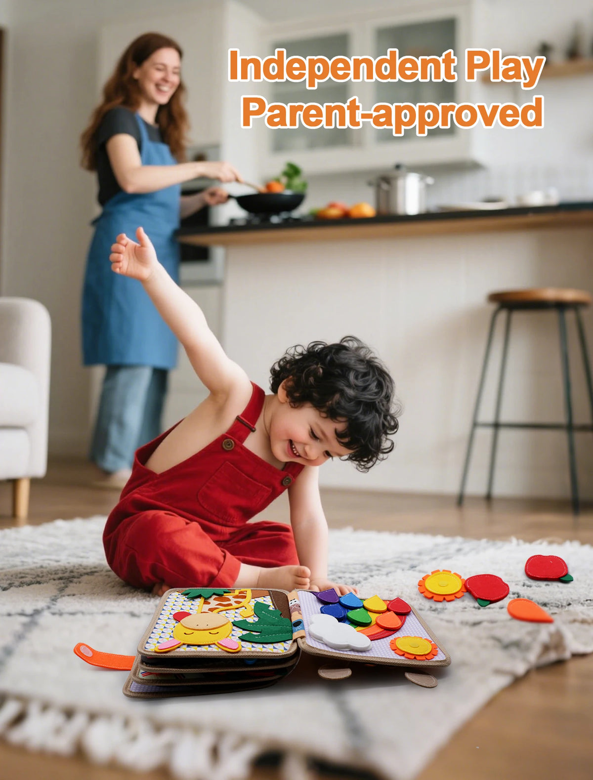 A young child is playing with a Montessori felt busy board featuring various colorful shapes and activities on a rug.