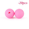 Two pink silicone beads, round and flexible, are shown against a white background.