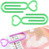 A set of two green plastic clips shaped like hearts and oval loops for holding diamond painting canvas.
