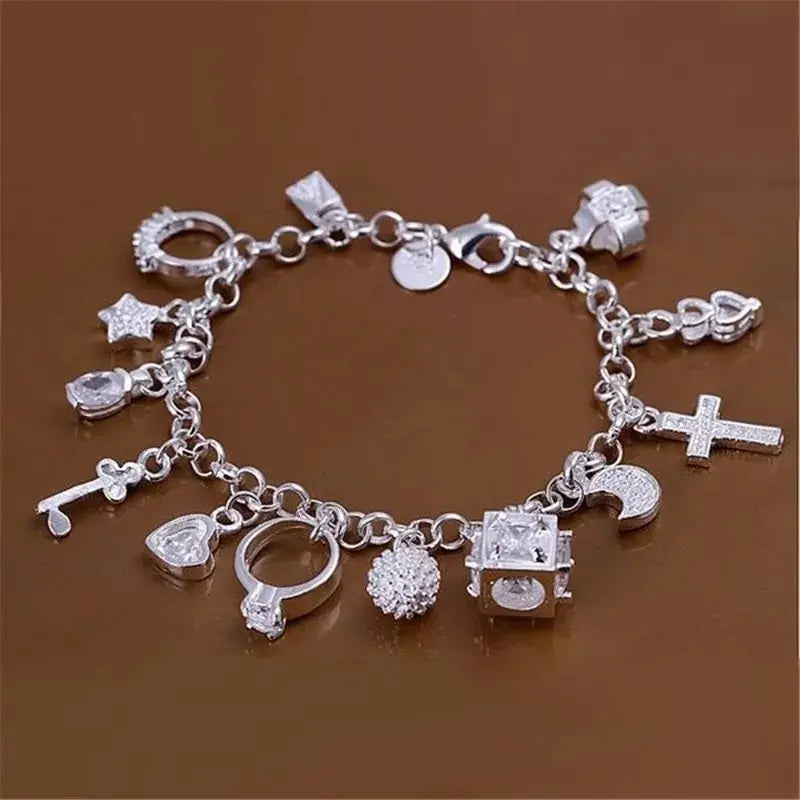 Silver Tone Crystal Charm Bracelet with Thirteen Pendants