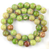 A circular arrangement of natural sea sediment jasper and turquoise beads for jewelry making
