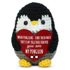 A handmade crochet penguin doll with black and white fur, featuring a red heart tag that reads When penguins find their mate 