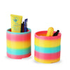 A set of rainbow-colored spring circle toys for hand-eye coordination and stress relief, including a yellow tube and black it