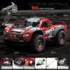 Red carbon brush plate for an Extreme Off Road RC monster truck with LED lights
