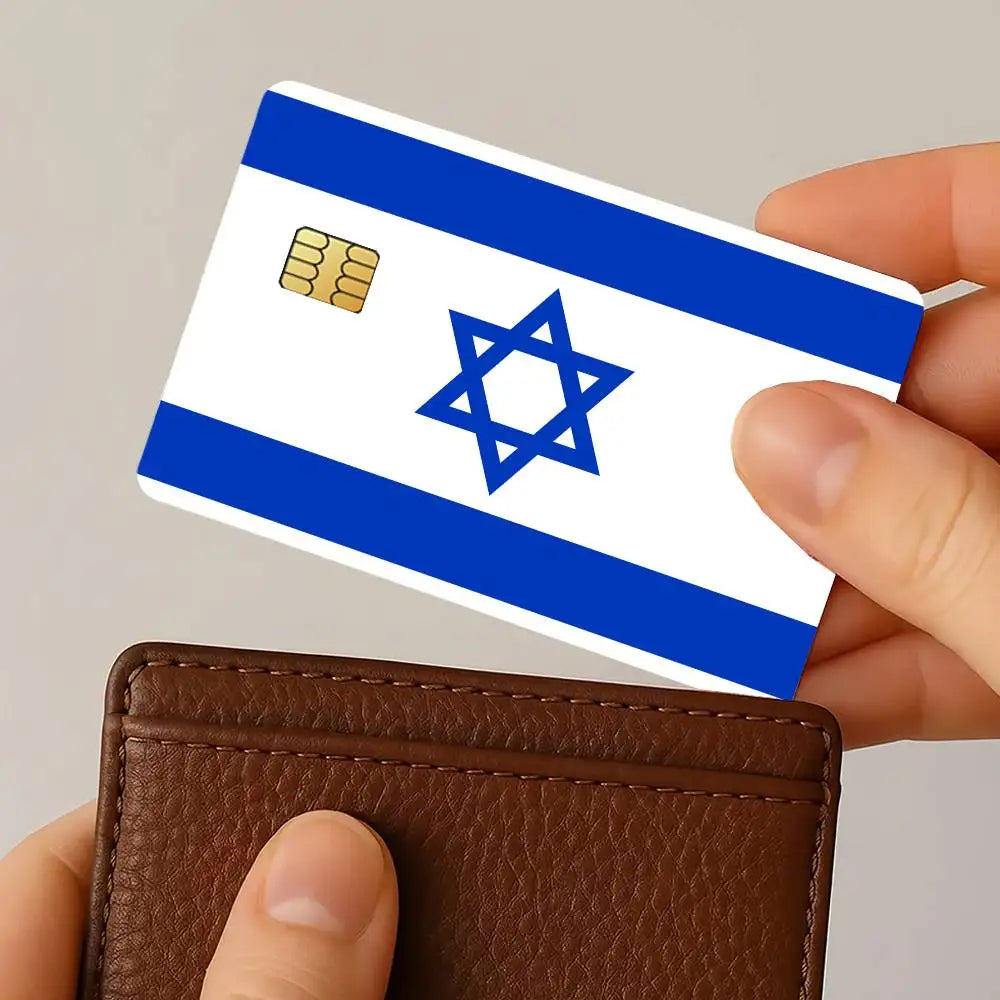A hand holds an Israel flag credit card skin sticker set featuring the Israeli flag design and a gold credit card symbol.