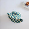 A teal and white checkered bucket hat is shown against a white background.