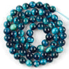 A strand of round, polished blue-green and deep blue natural sea sediment jasper and turquoise beads for jewelry making