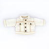 A white denim jacket for 1/12 scale dolls with brown stitching and buttons.