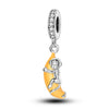 A silver fruit charm bead featuring a monkey design with a yellow-orange body and zircon stones.