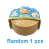 A beige silicone squeeze dumpling toy with a lid and age recommendation for 3 plus.