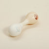 A light-colored wooden bear musical instrument, shaped like a horn, with a small floral design on the body.