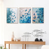 Three framed artworks featuring blue sea and butterfly motifs for home decor