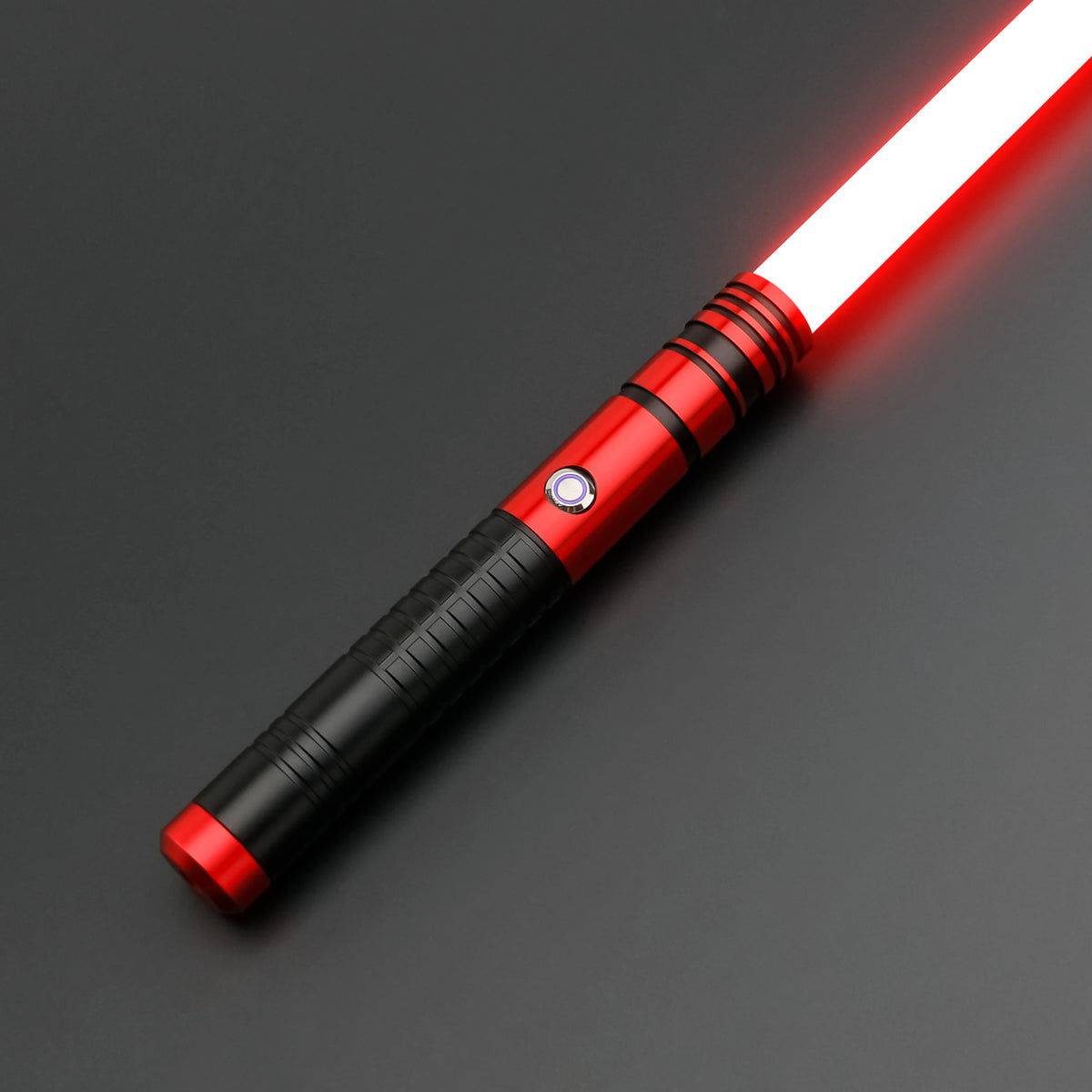 A red lightsaber toy with a metal handle and glowing blade is shown against a dark background.