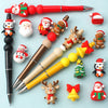 A collection of red and gold silicone beads, including Santa figures, reindeer, and Christmas trees, for crafting.