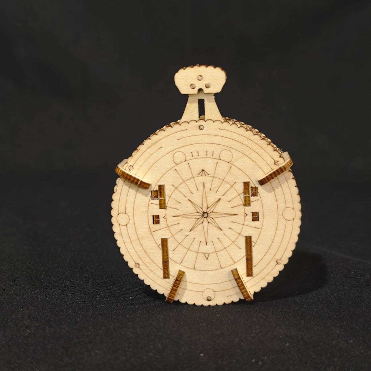 A wooden dice puzzle kit featuring a circular die with markings and a top piece, set against a dark background.