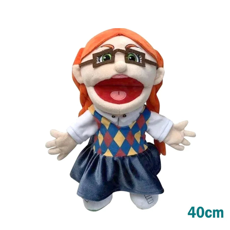 A realistic plush hand puppet with orange hair, glasses, and a wide open mouth, wearing a blue and yellow patterned outfit.