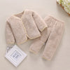 A beige fleece jacket and pants set for a baby, featuring a soft, fuzzy texture.