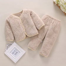 A beige fleece jacket and pants set for a baby, featuring a soft, fuzzy texture.