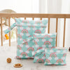 A set of three light blue waterproof bags with rainbow patterns for storing swimsuits, diapers, and travel items.