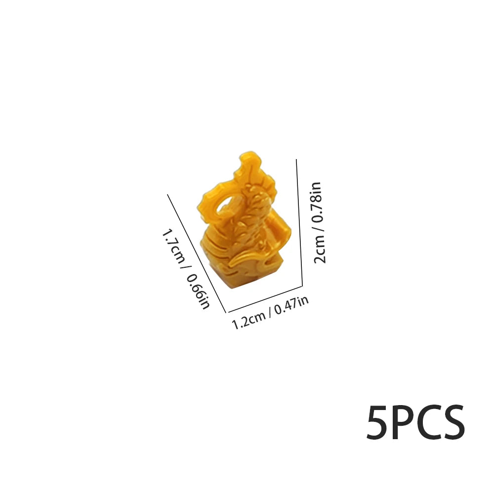 Five yellow plastic ocean animal building blocks or marine creatures.