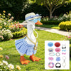 A white goose figure wearing a blue plaid skirt, orange boots, sunglasses, and a gold necklace in a sunny garden setting.