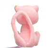 A pink kawaii anime plush doll with large ears and a long, curved body is shown.