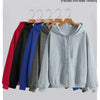 A display of various colored zip-up hoodies for sport and fashion, including red, black, blue, gray, and other shades.