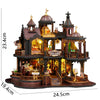 A detailed miniature dollhouse kit of a seaside beach house featuring multiple levels and architectural details.