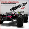 A black brushless 4WD monster truck RC car with large tires and a suspension shock absorber visible.