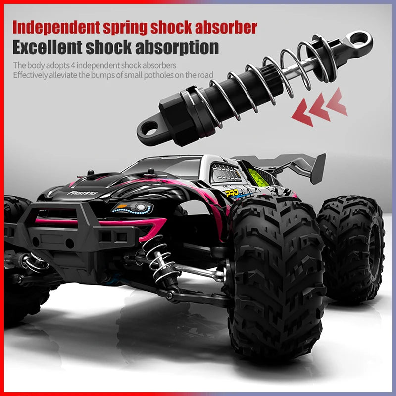 A black brushless 4WD monster truck RC car with large tires and a suspension shock absorber visible.