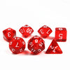A set of red polyhedral dice including a d6, d8, d10, and d12, arranged on a white surface.