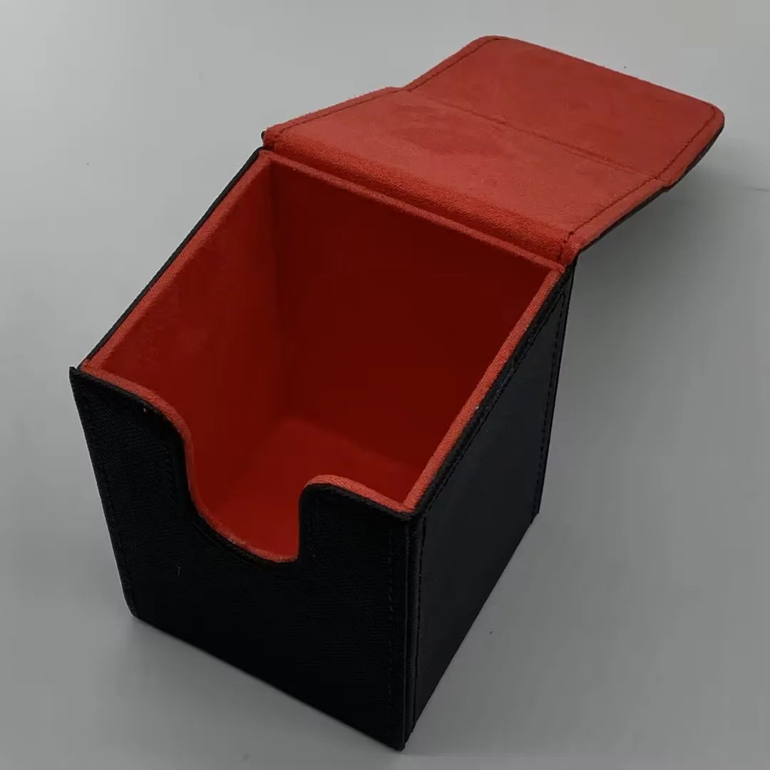A black leather deck box with a red lid is shown from above.
