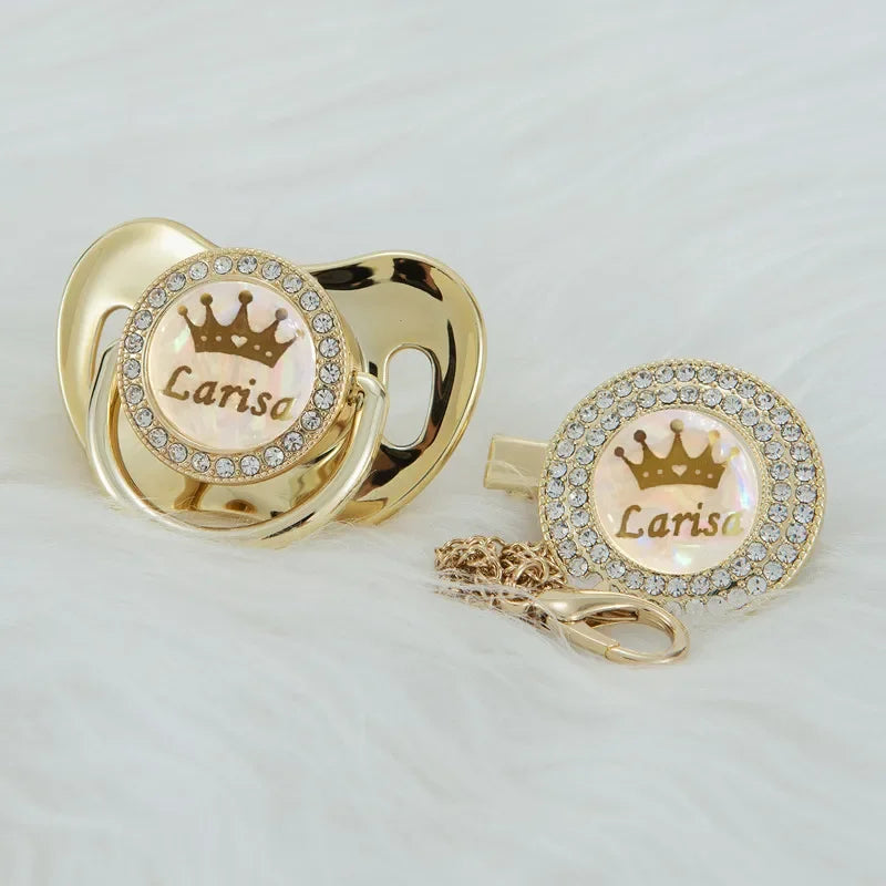 Personalized rose gold crown pacifier and clip set with a pearl inlay and diamond detail