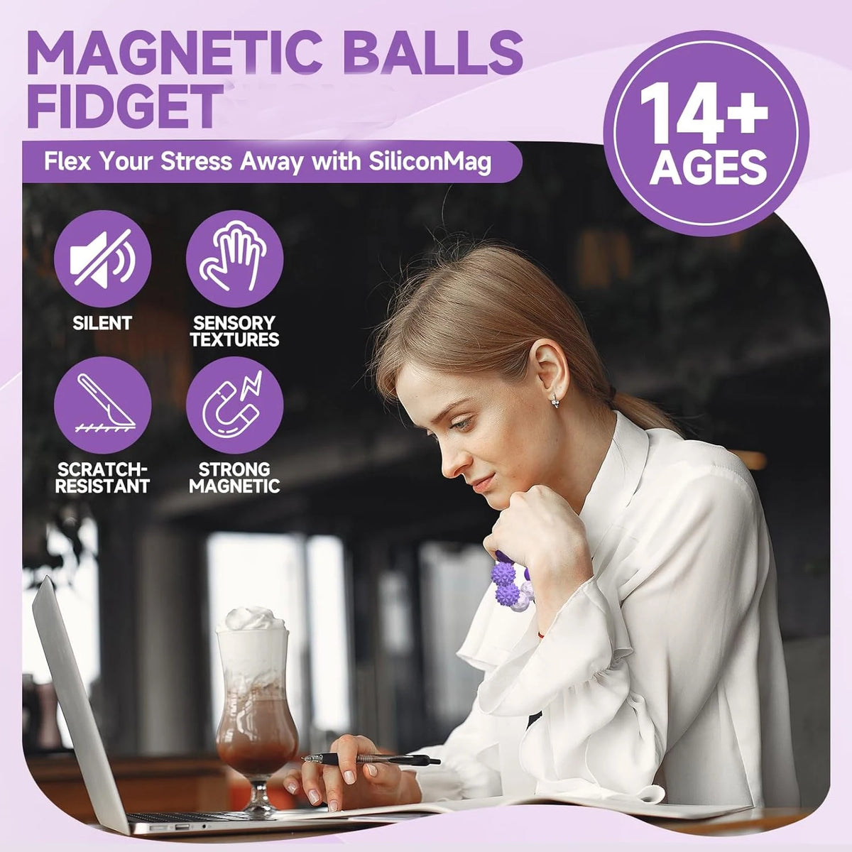 A woman is using a magnetic ball fidget toy on a laptop, demonstrating its use for stress relief.