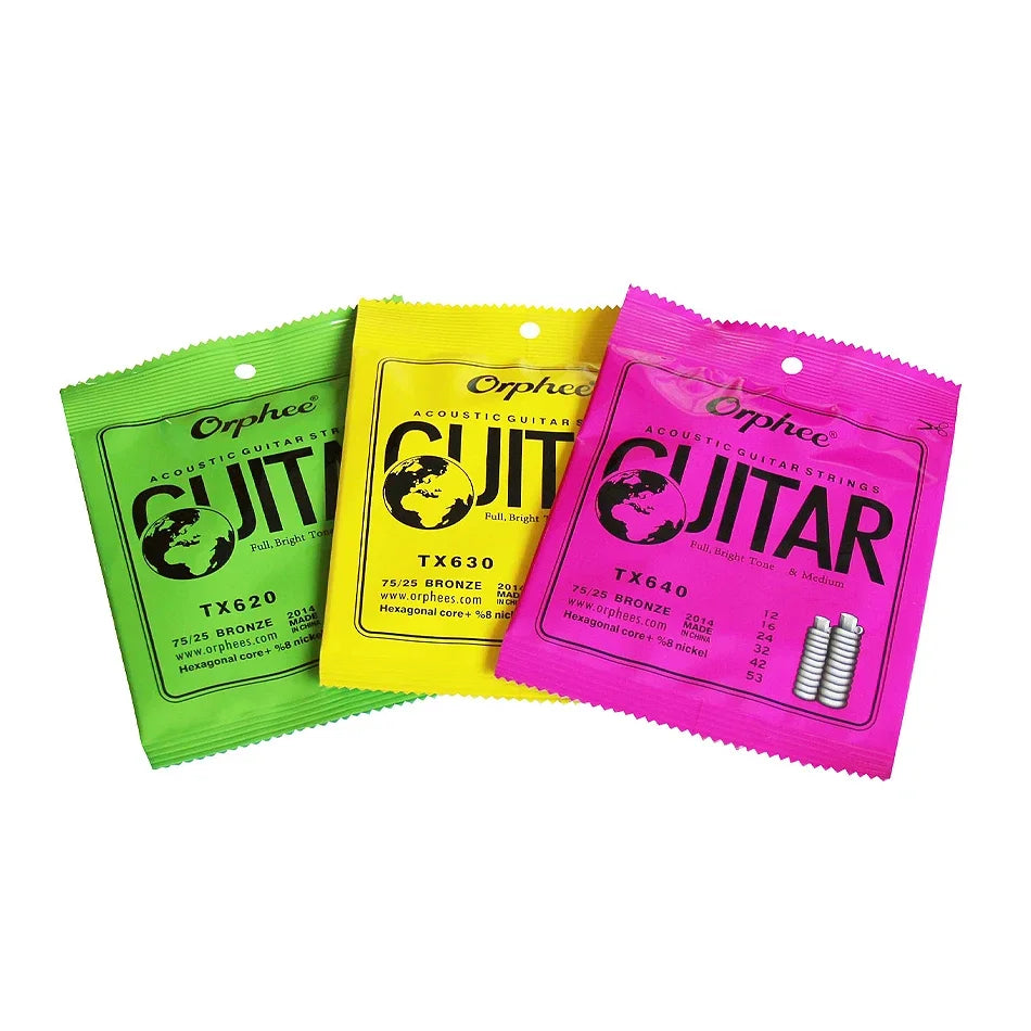 Three packets of Orphee acoustic guitar strings in bright green and pink packaging