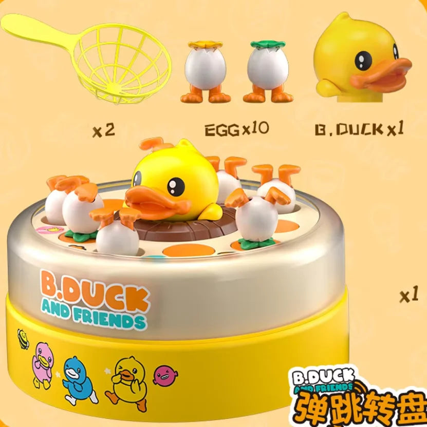 A set of B.Duck and friends toys including a yellow duck, white ducks, and a yellow serving dish.