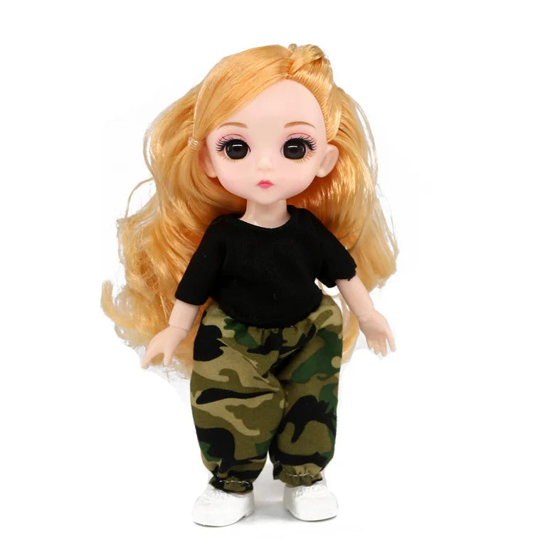 An orange-haired Articulated BJD princess doll wearing camouflage pants and a black shirt.
