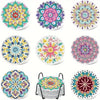A collection of eight colorful diamond art coasters with holders in various floral and geometric patterns.